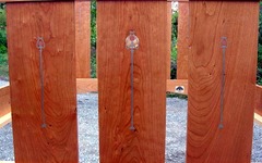 Close-up three inlaid slats of cherry wood. Pewter, copper and curly maple inlay.